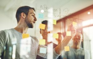 Young designers using sticky notes